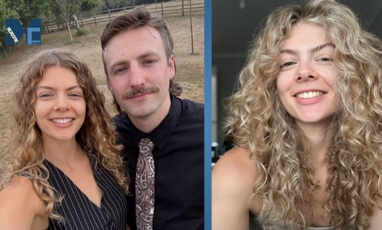 Nancy Mitchell smiling in her signature curly blonde hairstyle, standing next to her partner.