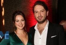 Welsh singer Charlotte Church and her husband, musician Jonathan Powell, smiling at an event.