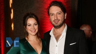 Welsh singer Charlotte Church and her husband, musician Jonathan Powell, smiling at an event.