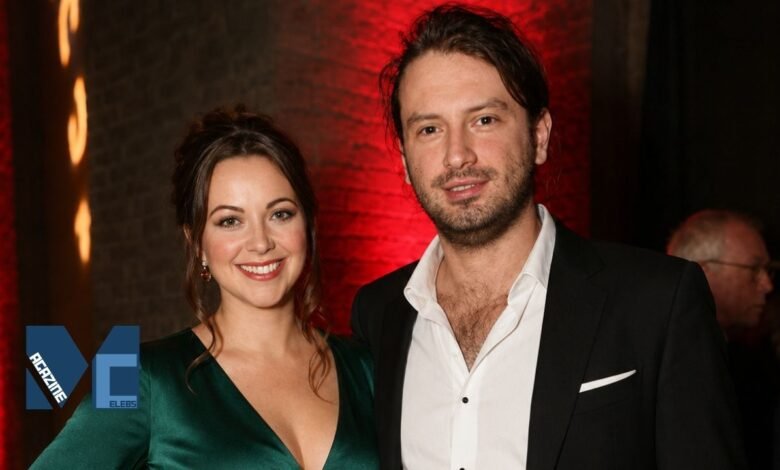 Welsh singer Charlotte Church and her husband, musician Jonathan Powell, smiling at an event.
