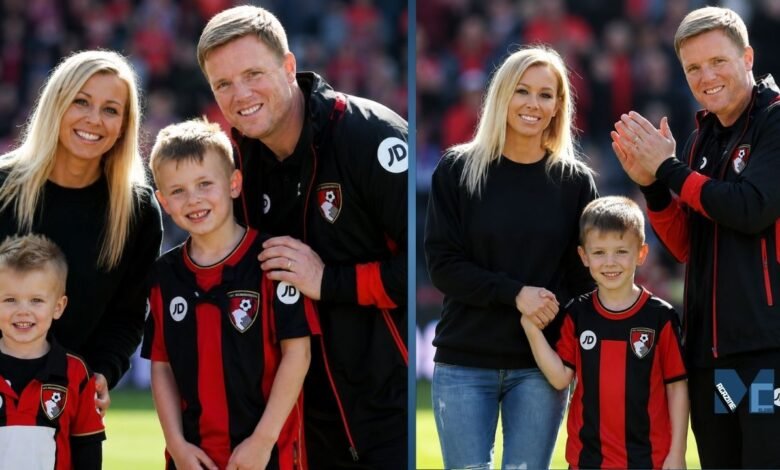 Eddie Howe smiling with his wife Vicki Howe and their two elder sons, Rocky and Harry Howe, wearing AFC Bournemouth kits on the pitch.
