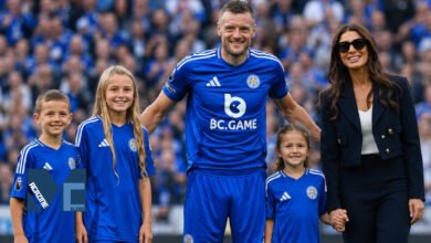 Jamie Vardy and Rebekah Vardy with their children Sofia, Finley, and Olivia on the pitch at Leicester City.