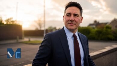 British political strategist Joe Dancey, the Executive Director of Policy and Communications for the Labour Party, posing in a professional suit and tie during sunset.