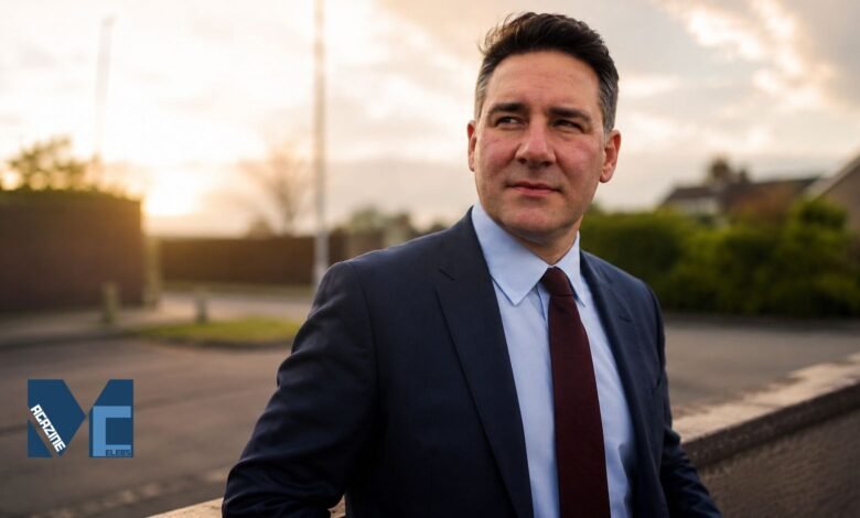 British political strategist Joe Dancey, the Executive Director of Policy and Communications for the Labour Party, posing in a professional suit and tie during sunset.