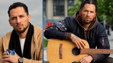 Jonathan Berkery, estranged son of Tom Jones, posing in a brown hoodie and holding an acoustic guitar outdoors