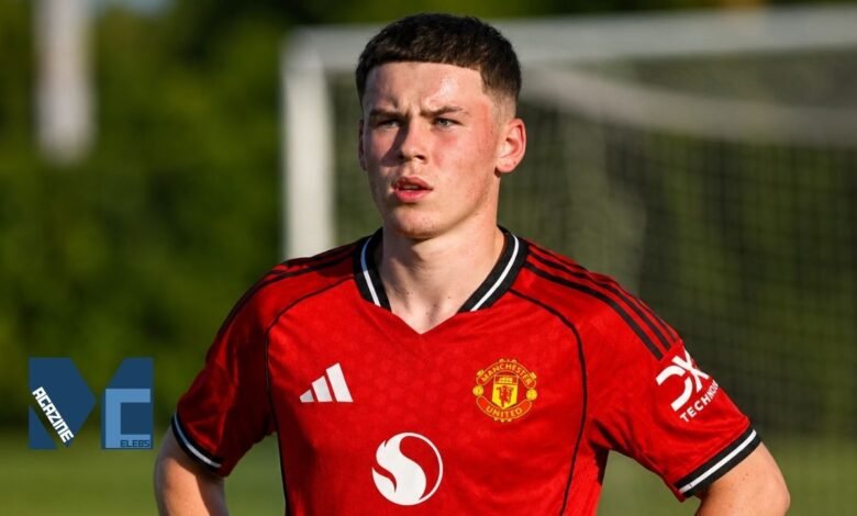 Kai Rooney wearing the red Manchester United youth kit on the training pitch with a football goal net visible in the background.