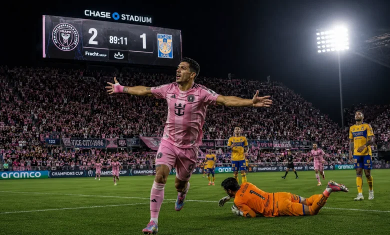 Luis Suarez celebrating his match-winning penalty goal in the 89th minute for Inter Miami against Tigres UANL at Chase Stadium scoreboard showing 2-1.