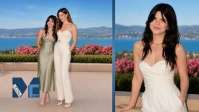 Mae Sandler posing alongside her mother Kathryn Hahn at an outdoor coastal event with scenic ocean views and floral surroundings.