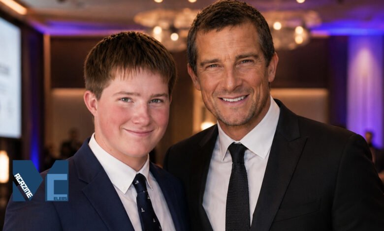 Marmaduke Mickey Percy Grylls standing next to his father Bear Grylls at a formal event, both wearing suits.