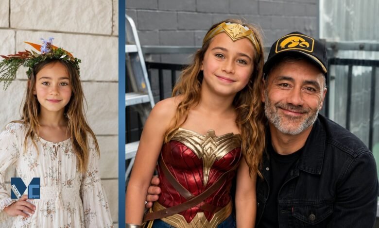 Director Taika Waititi posing alongside his young daughter, Matewa Kiritapu, who is dressed in a Wonder Woman costume.