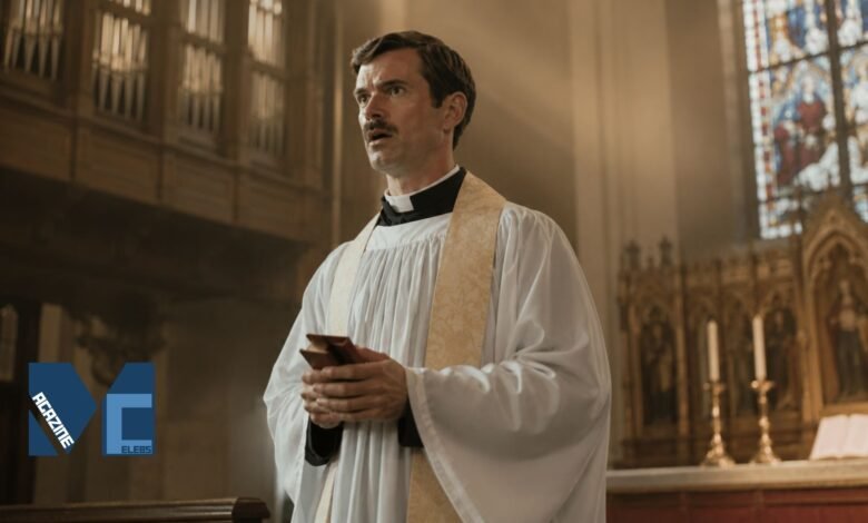 Actor Patrick Carr, younger brother of Jimmy Carr, dressed as a priest holding a small red book in a church setting.