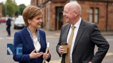 Peter Murrell and Nicola Sturgeon speaking together outdoors during a public appearance in Scotland
