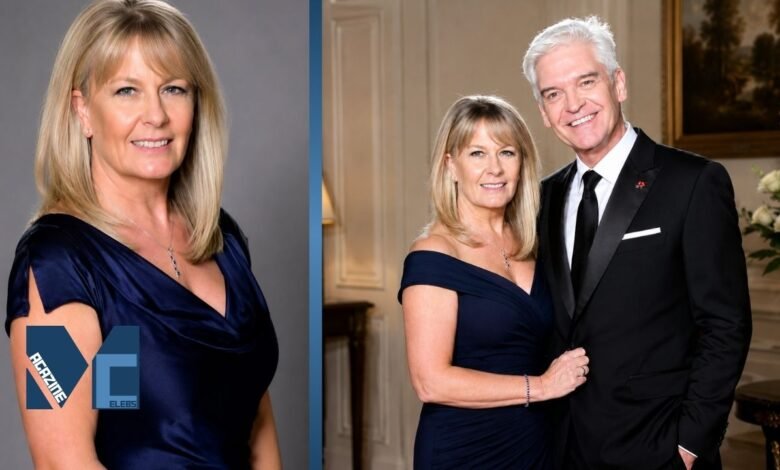 Stephanie Lowe posing in an elegant navy blue dress during a formal portrait session with her husband.
