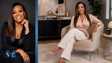 Portrait of Annie Moody smiling in elegant business attire during a professional photoshoot in 2026.