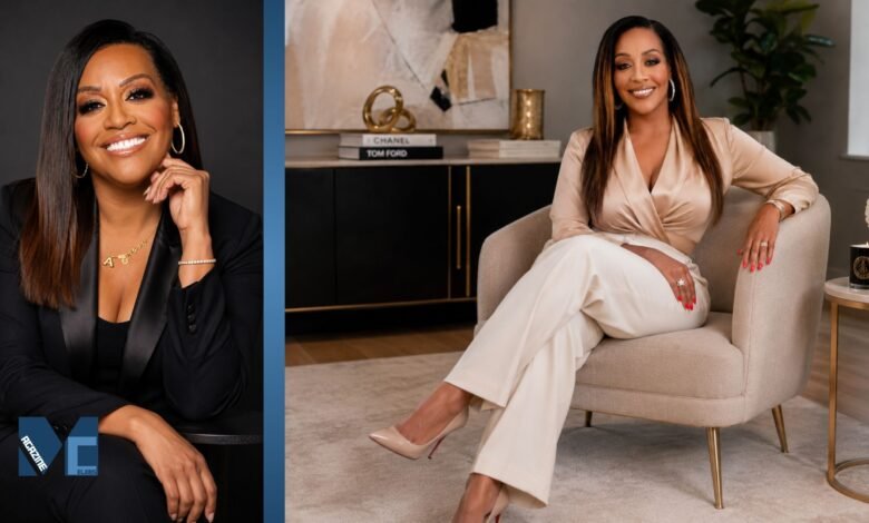 Portrait of Annie Moody smiling in elegant business attire during a professional photoshoot in 2026.
