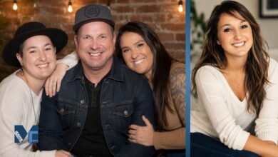 August Anna Brooks smiling in a family portrait alongside her father Garth Brooks and family members, highlighting her private life and family background.
