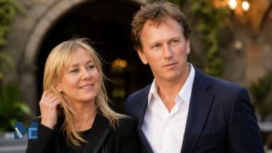 Christian Horner in a navy blue blazer standing next to his former partner Beverley Allen.