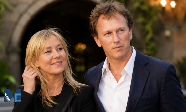 Christian Horner in a navy blue blazer standing next to his former partner Beverley Allen.
