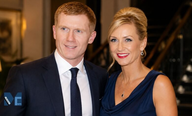 A formal portrait of Claire Froggatt and her former husband, Manchester United legend Paul Scholes, smiling together at an evening event.