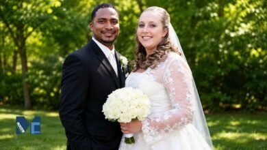 Corrie Bird and Trent Batson posing together during their wedding ceremony in Indiana.
