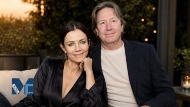 Real estate finance executive Mark Fluent and his wife, actress Justine Bateman, sitting together and smiling in a relaxed outdoor setting.