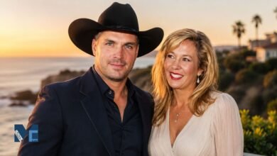 A portrait of Sandy Mahl smiling warmly alongside her former husband, country music star Garth Brooks, standing outdoors at sunset.