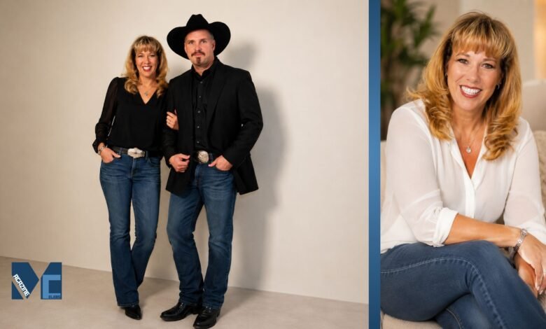 Sandy Mahl smiling in a casual portrait wearing a white blouse and blue jeans in a warm indoor setting.
