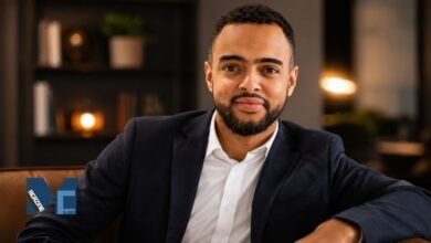 A professional portrait of Sened Teame, CFO of Cloud Nine AB and older brother of footballer Alexander Isak, sitting in a modern office.