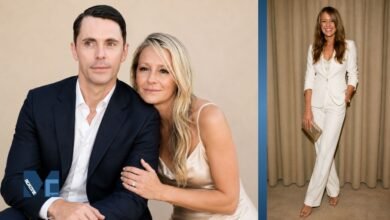 Sophie Dymoke posing with husband Matthew Goode at a public event and standing in a white tailored suit.