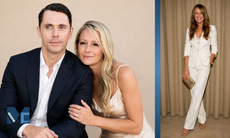 Sophie Dymoke posing with husband Matthew Goode at a public event and standing in a white tailored suit.