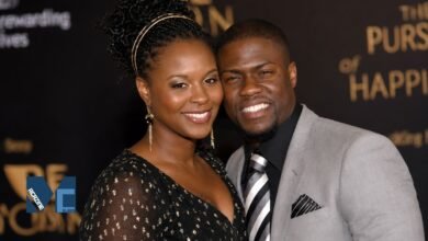 Torrei Hart smiling elegantly in a black dress while posing alongside her then-husband, comedian Kevin Hart, at a Hollywood red carpet event.