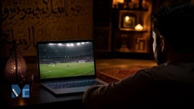 Person watching a live football match on a laptop using an online football streaming platform